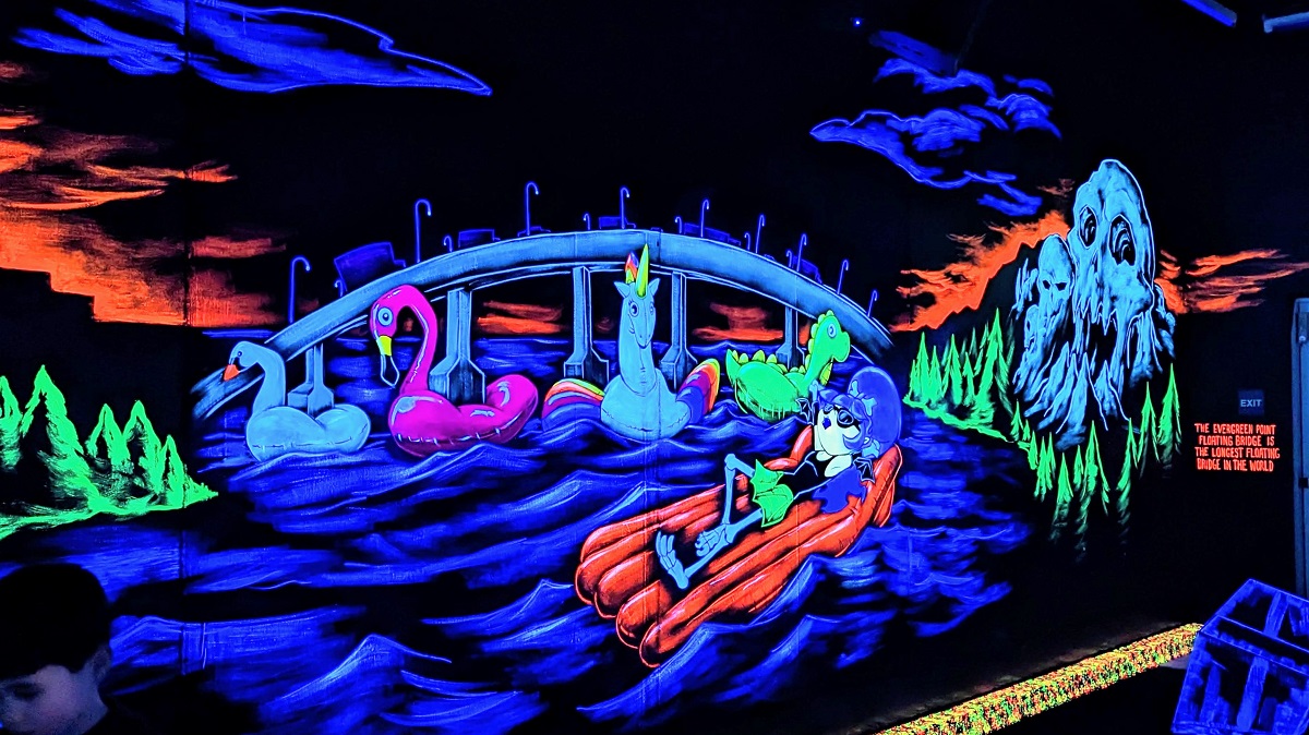 Beautiful and interesting murals decorate the walls at Monster Mini Golf, newly opened family entertainment venue on Bellevue Washington near Seattle