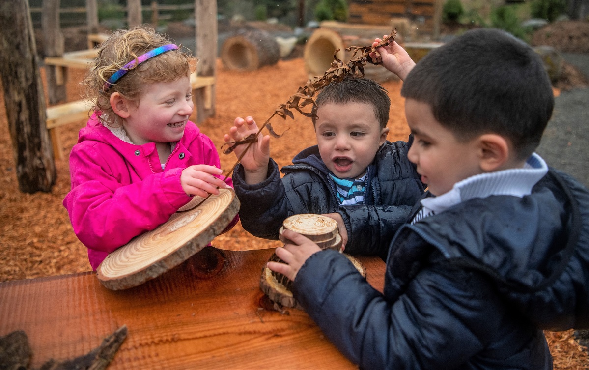 Kids play at the Builder’s Deck at the new Little Explorers Nature Play Garden at Tacoma’s Point Defiance Zoo & Aquarium