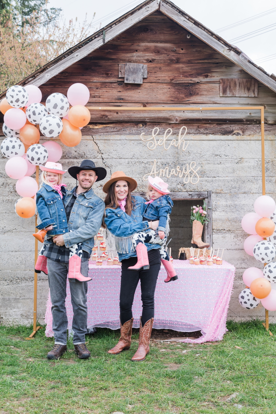 "A family dressed in cowboy gear having a birthday part at Infinity Farms"