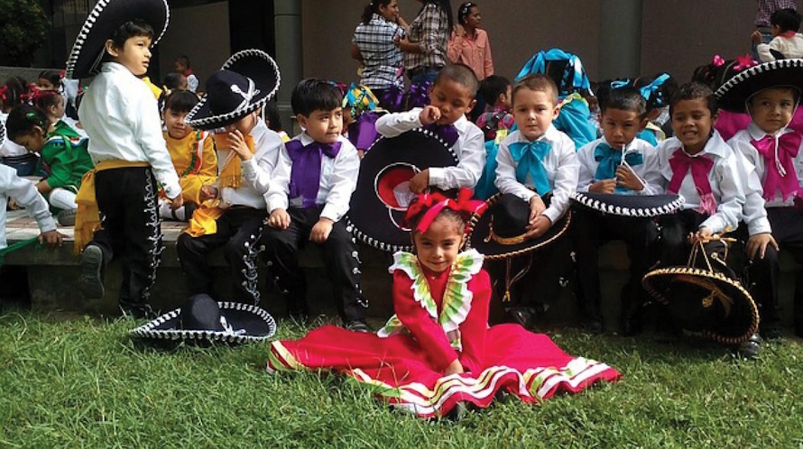 "Children sitting around at Sea Mar Fiestas Patrias "