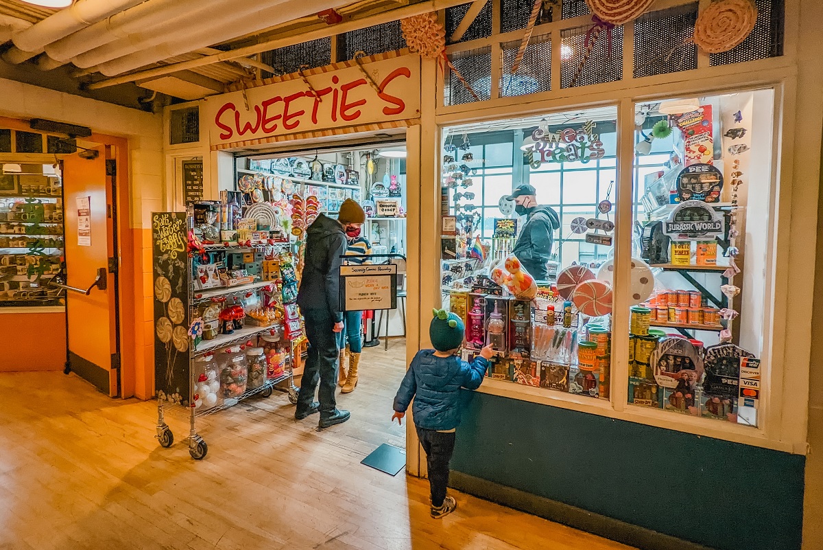 At Pike Place Market shop Sweetie’s, stock up on sweet treats and gum to stick on the gum wall