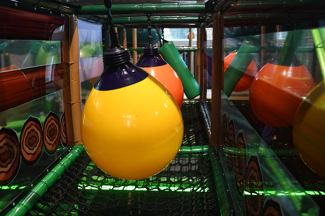 Obstacles to dodge as kids climb through the jungle climber at The Ridge Activity Center near Seattle, Wash.