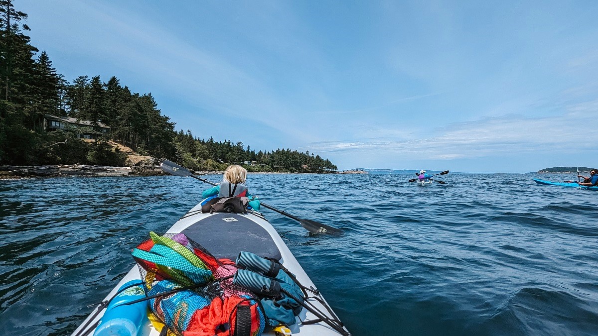San Juan Islands family kayaking trips feature double kayaks so you can paddle with your child