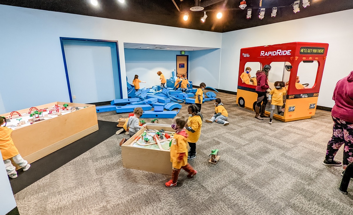Kids play with foam blocks at the reopened Seattle Children's Museum at Seattle Center