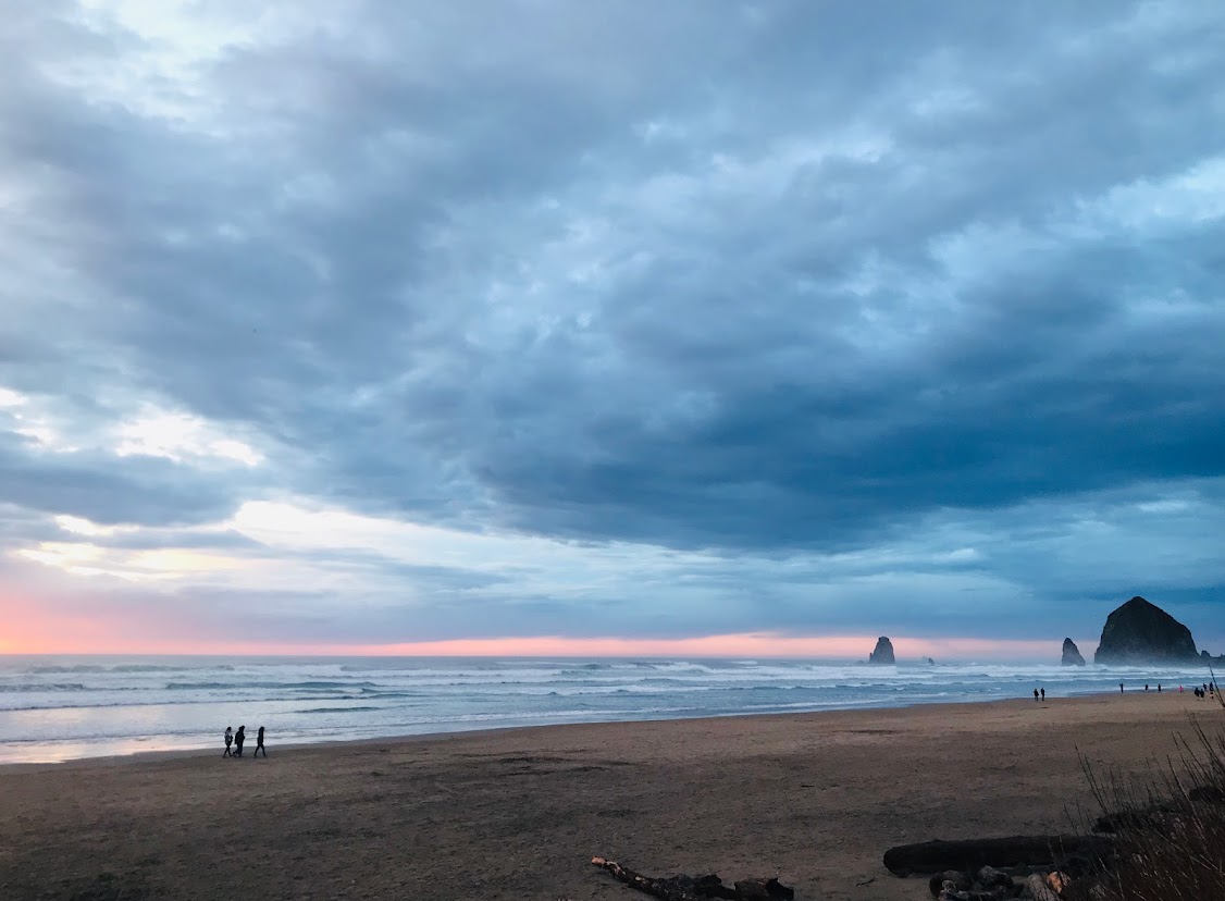 A sunset view of Tolovana Beach State Recreation Site and Haystack Rock
