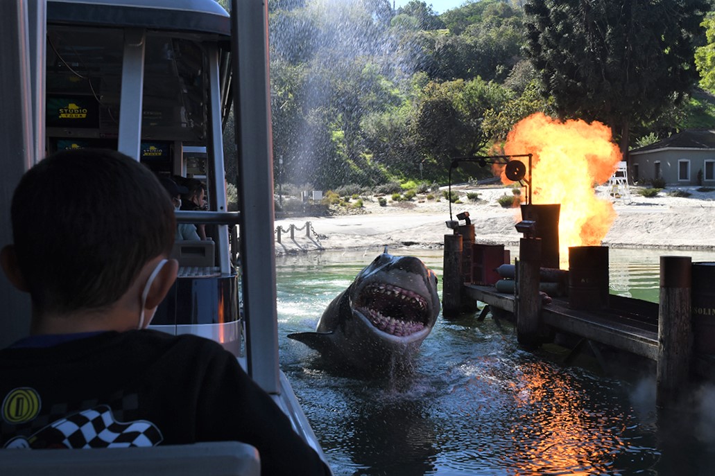 Scene from Universal Studios Hollywood famous Studio Tour passing the Jaws lagoon with shark emerging best tips for families wizarding world of harry potter