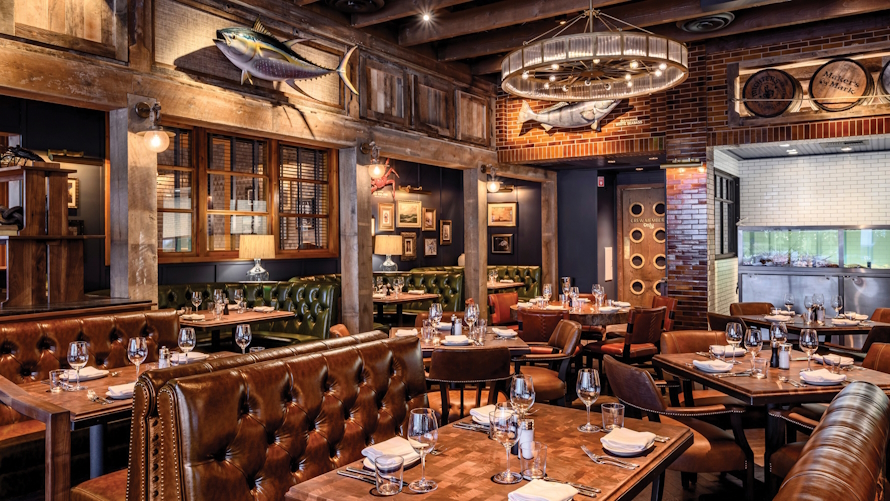 "nice restaurant, the Water Grill, with leather booth seats and large mounted fish on the wall, "
