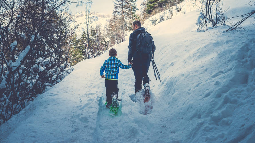 "Dad and son snowshoeing one on one time"
