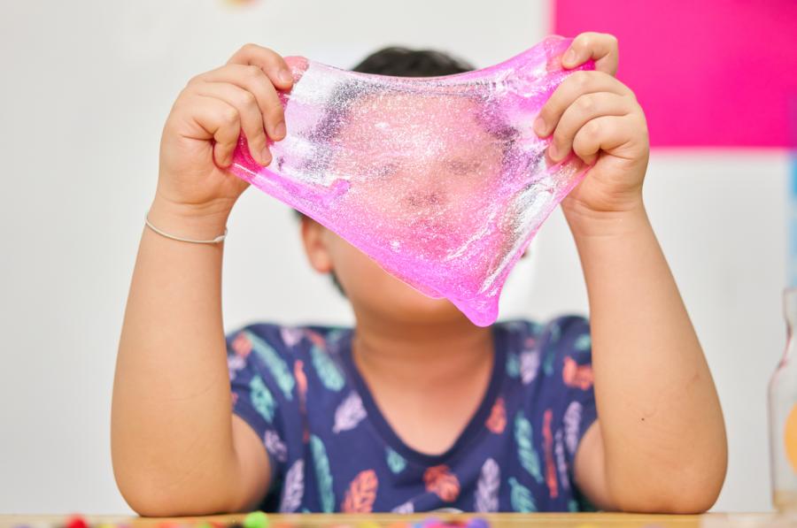 boy holding pink slime