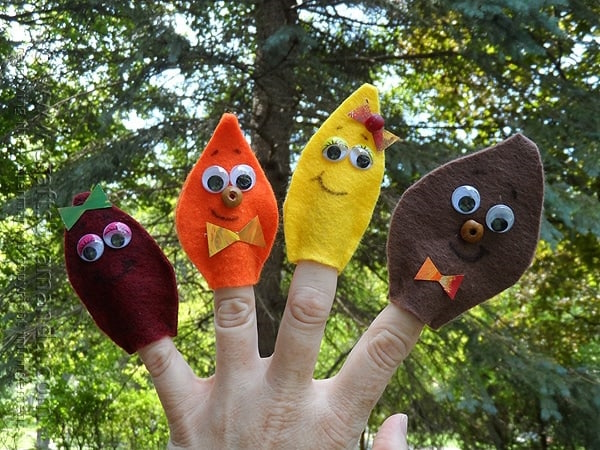 "Hand with felt leaf finger puppets"