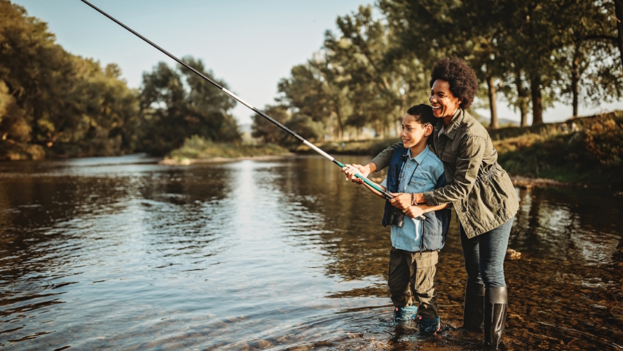 "Mom and son fishing on a Washington river"