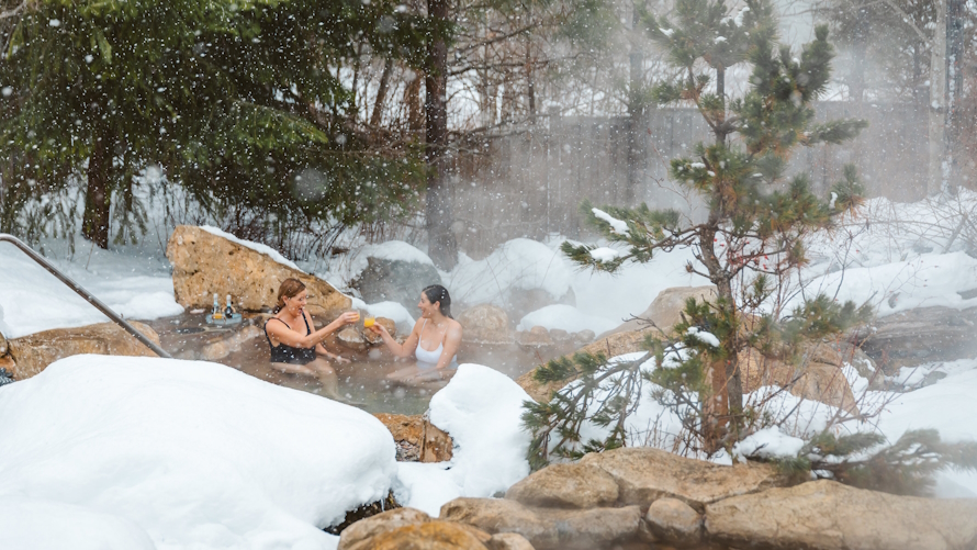 "Two women in a spa at Suncadia in the snow"