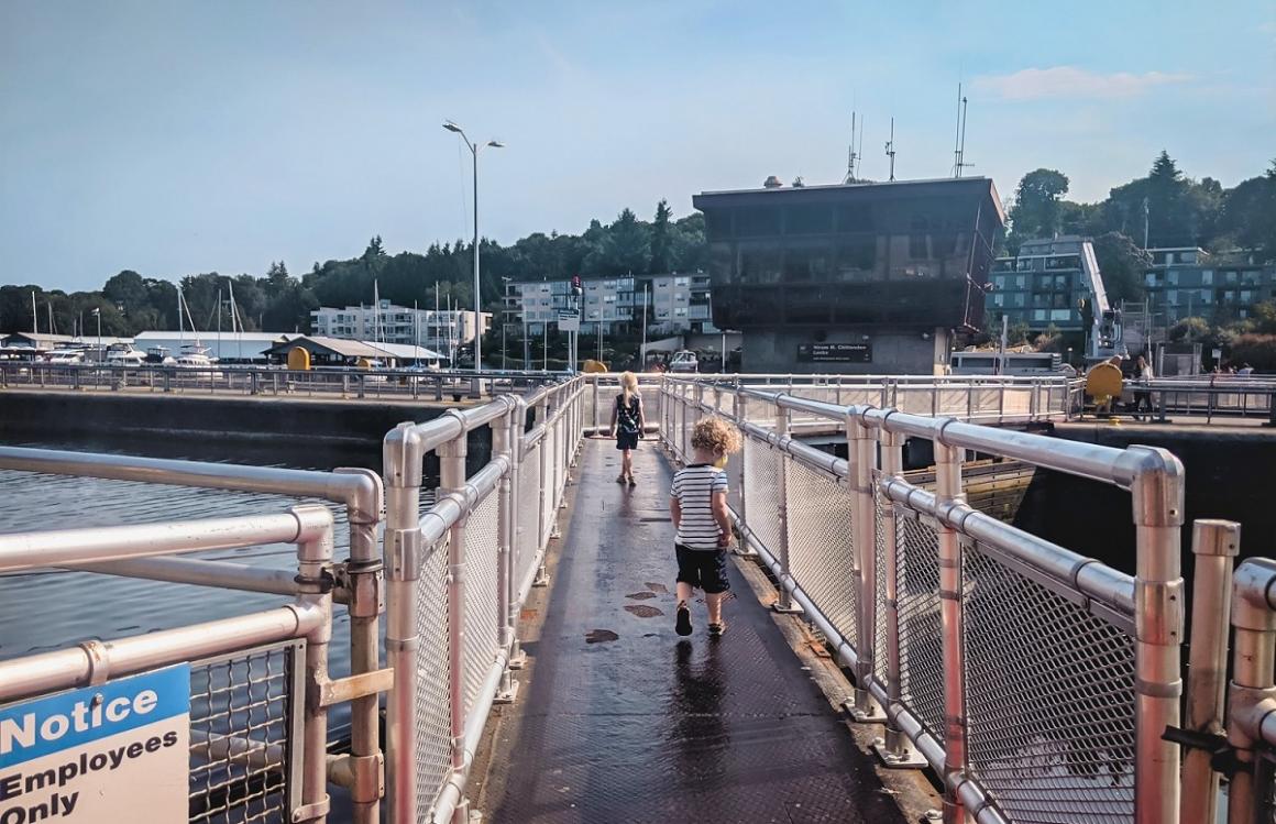 Kids crossing the Ballard Locks bridgways across the Locks top Seattle tourist attraction for families and kids