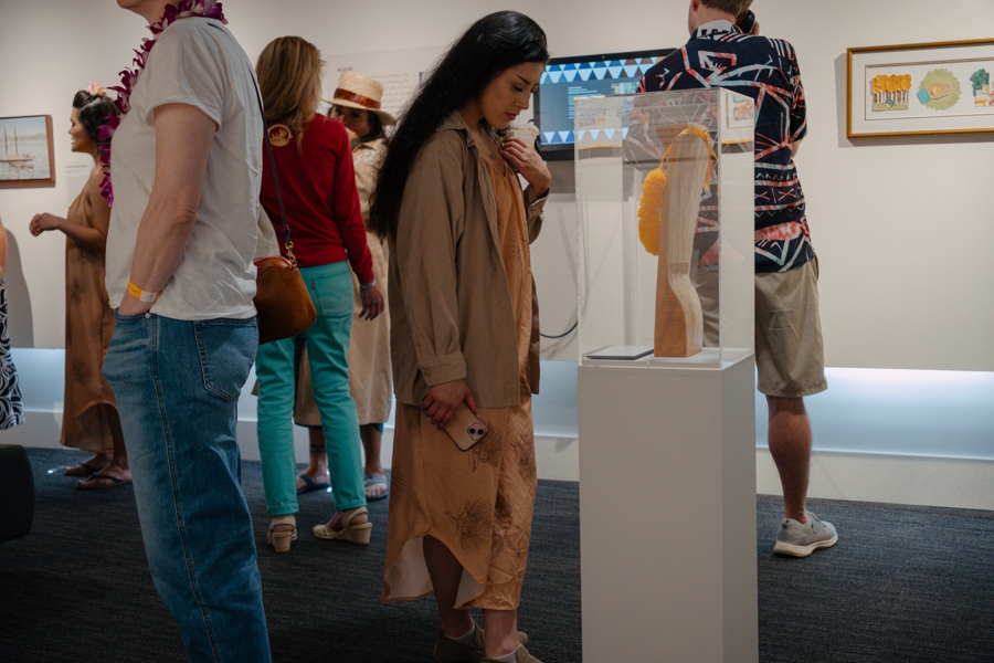 woman looking at an exhibit at the DISplace exhibit at the Wing Luke Museum