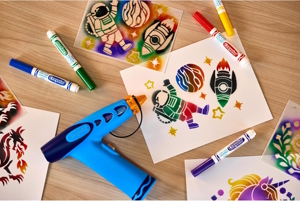 collage of airbrush and art made by kids on a table laid out for gift giving