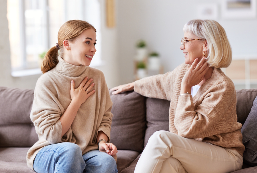 mother and daughter sitting and talking together