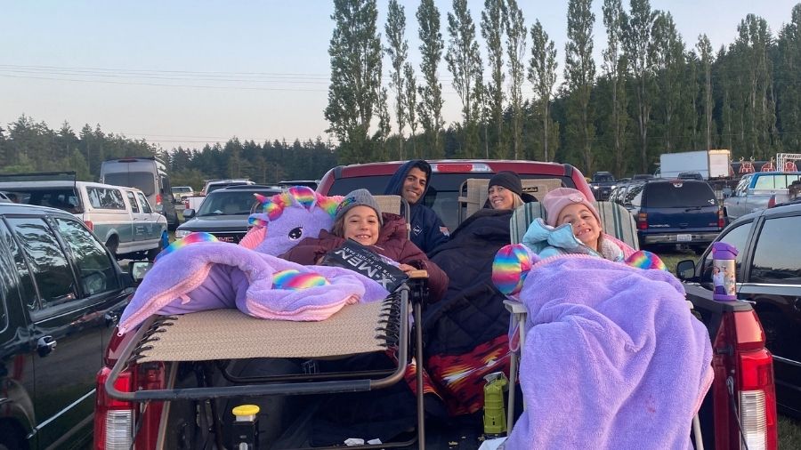 family at drive-in theater