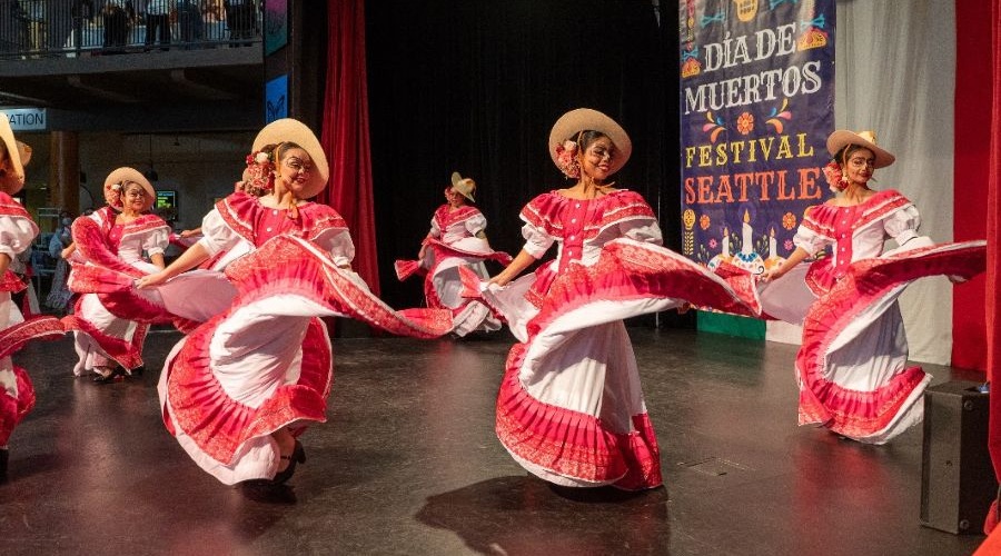 Dancers in costume perform at the Seattle Center Festal series Día de Muertos Festival.