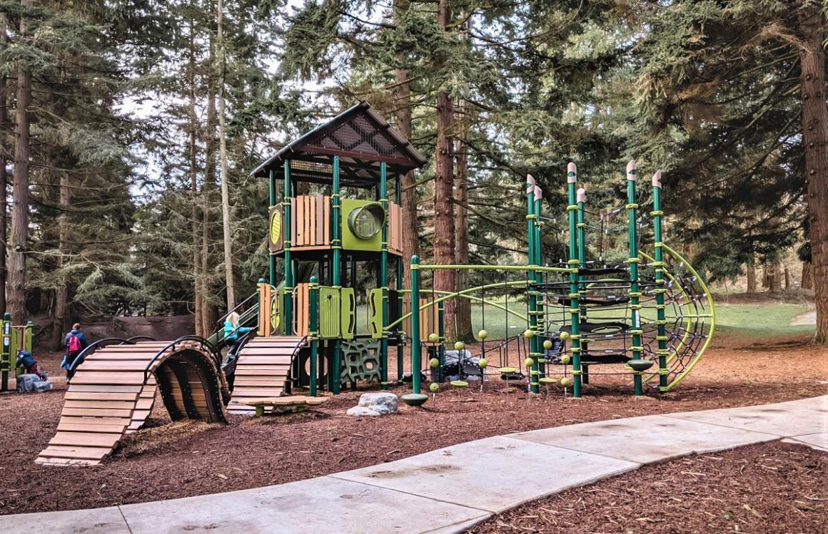 View of the big kid play structure at Discovery Park's renovated playground best biggest parks in the Seattle area
