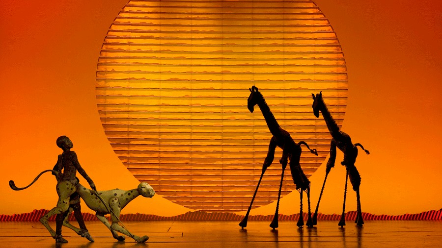Cheetahs and giraffes take the stage for the opening Circle of Life during The Lion King musical