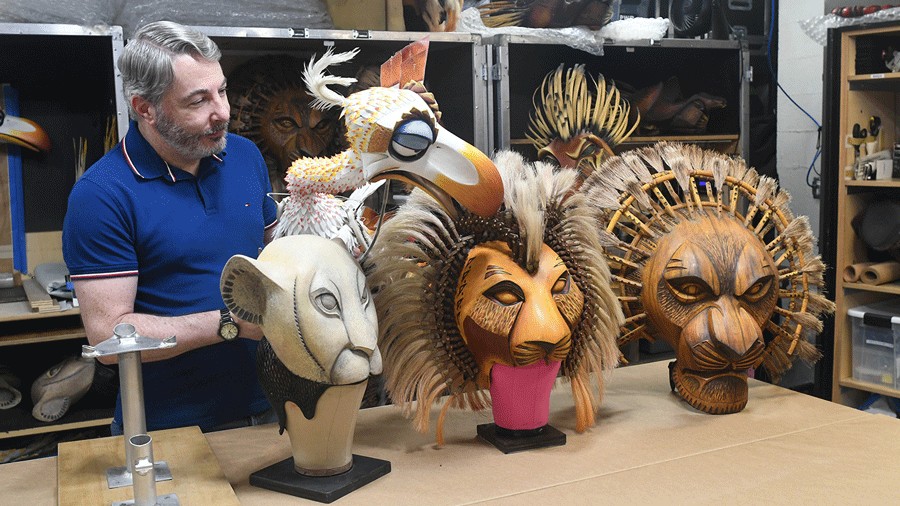Puppet supervisor shows off masks during a behind-the-scenes look at The Lion King in Seattle