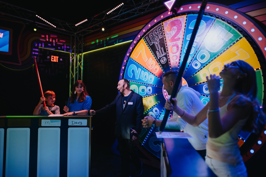 families playing game with giant pencils at Great Big Game Show