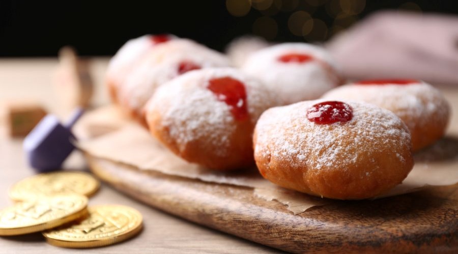 Doughnuts, gelt and dreidels are part of Hanukkah celebrations. 