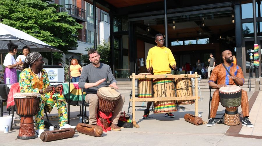 An African drumming group performs at Kenmore's Juneteenth celebration.