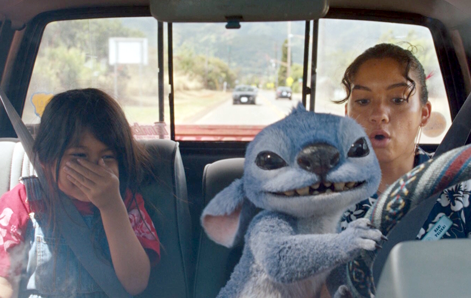 characters from Lilo And Stitch in the cab of a car