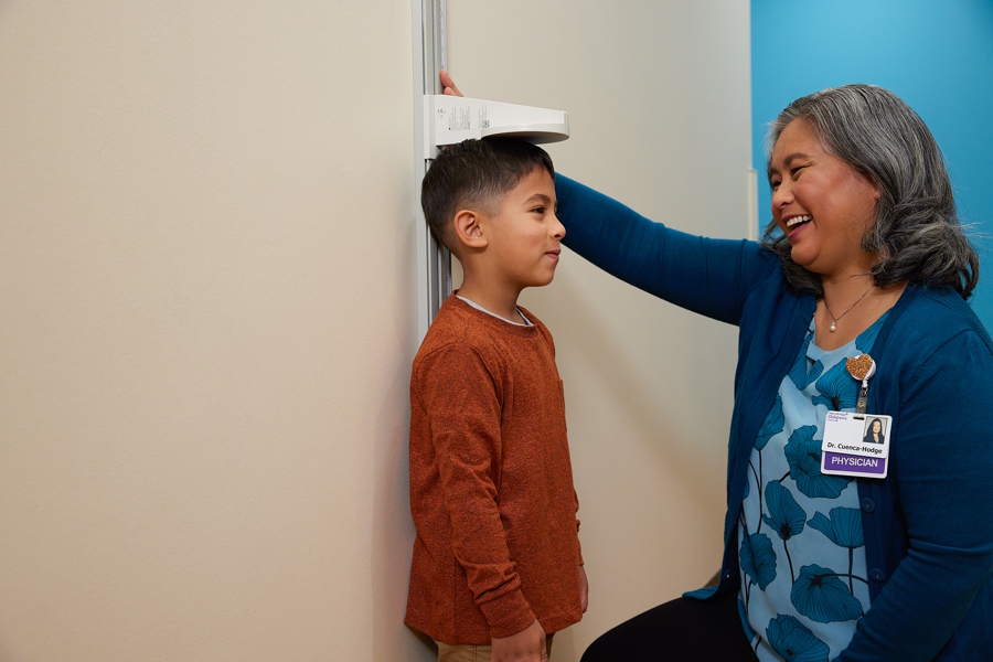 Boy being measured at a doctors office