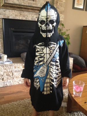 Young boy in a Halloween sweatshirt