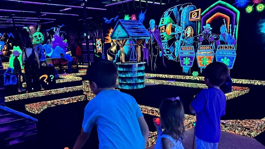 kids playing Monster Mini Golf