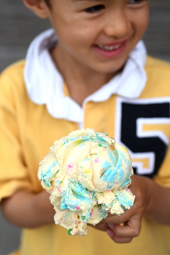 Happy boy holding kiddie ice cream cone from Snow Goose Mount Vernon Skagit County, Wash.