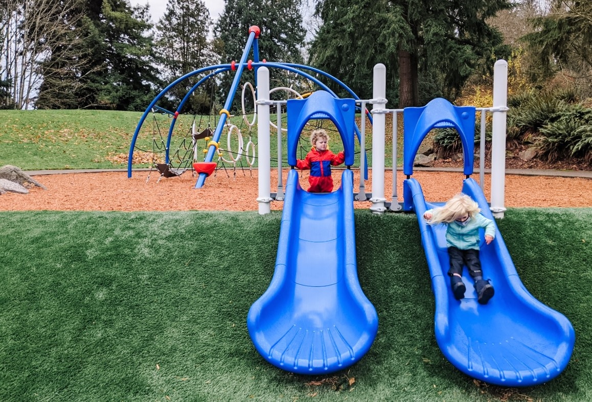 Double blue slides at North Kirkland Community Center and Park's new space-themed playground