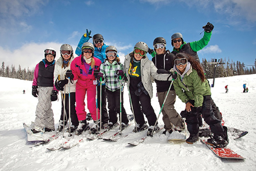 snowboarding family smiling