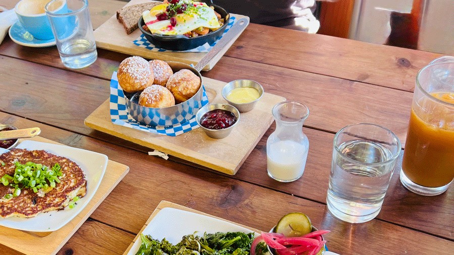 Broder Café meal for families in Portland, with doughnuts, eggs and pancakes