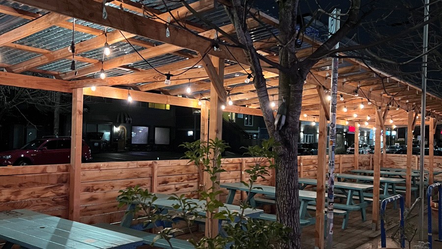 outdoor dining in Portland near Friendship Kitchen with picnic tables and string lights