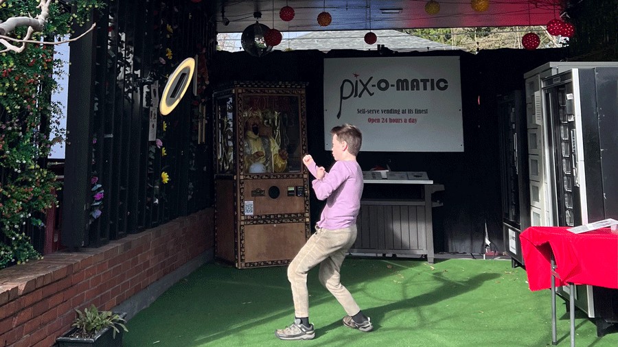 kid picking a dessert at Pix-o-matic dessert vending machine in Portland