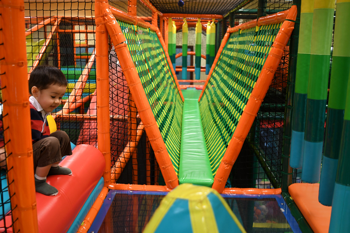 A small boy plays in the climbing structure at Safari indoor play space in Seattle’s Southcenter Mall and now open in Auburn Outlet Collection