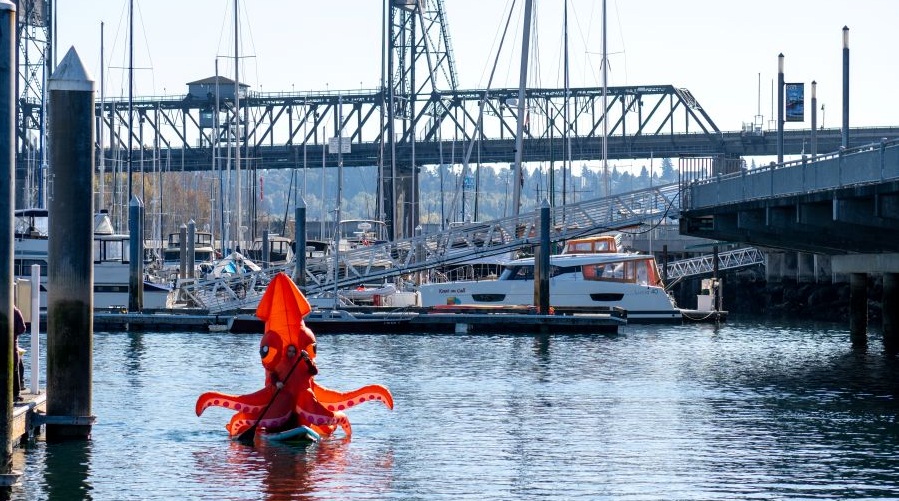 A costumed paddler out on the water at Foss Waterway Seaport Museum's Halloween event.
