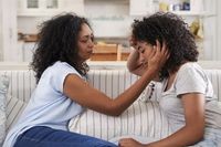 Mom comforting her teenage daughter