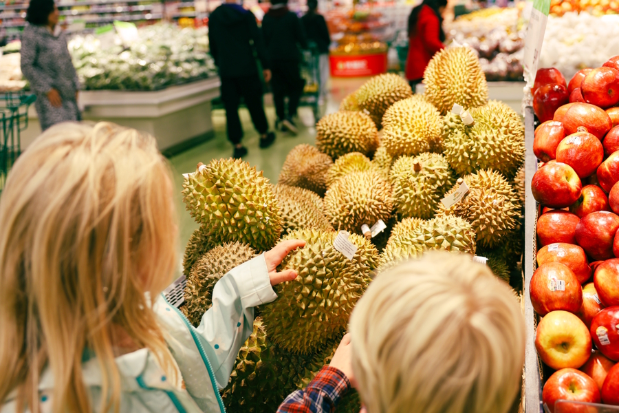 kids exploring the produce at T&T market