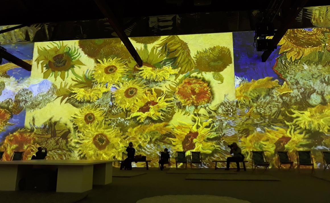 A projection of Van Gogh’s painted sunflowers appears on the wall at Van Gogh The Immersive Experience in Seattle fall and winder 2021