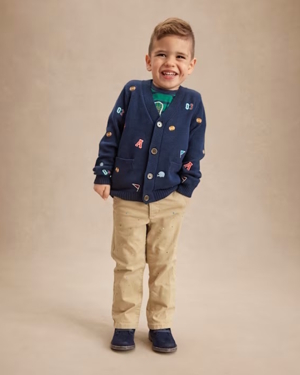 boy wearing a varsity sweater