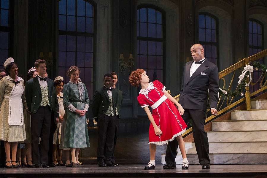 Annie and Daddy Warbucks in The 5th Avenue's production of Annie