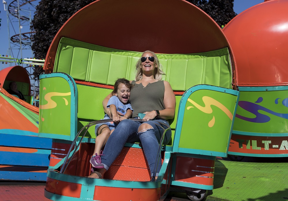 Mom and child on a ride at the Washington State Fair in Puyallup