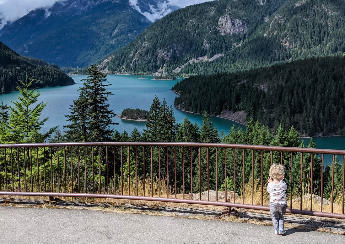 View of Diablo Lake with child looking family getaway to Winthrop from Seattle