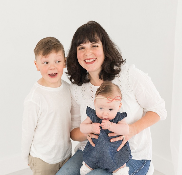 Image of dark-haired smiling woman, ParentMap writer Lisette Wolter-McKinley, along with her kids, a young boy and baby girl