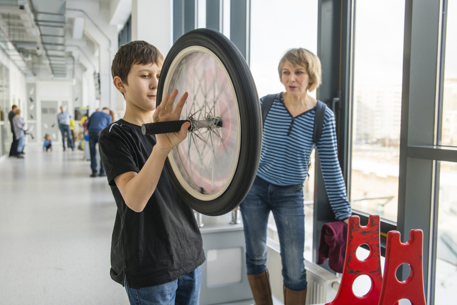 boy and his mom at a science museum