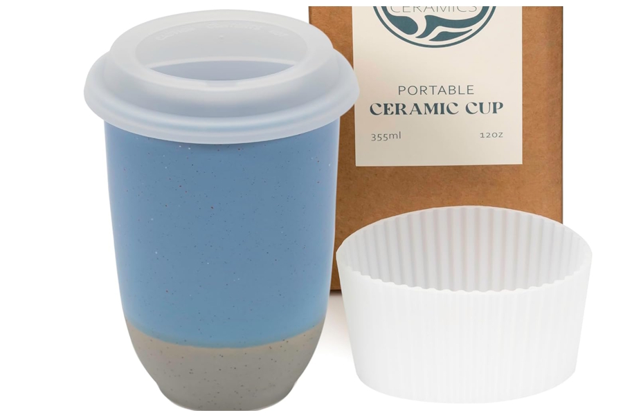 a ceramic coffee mug with lid